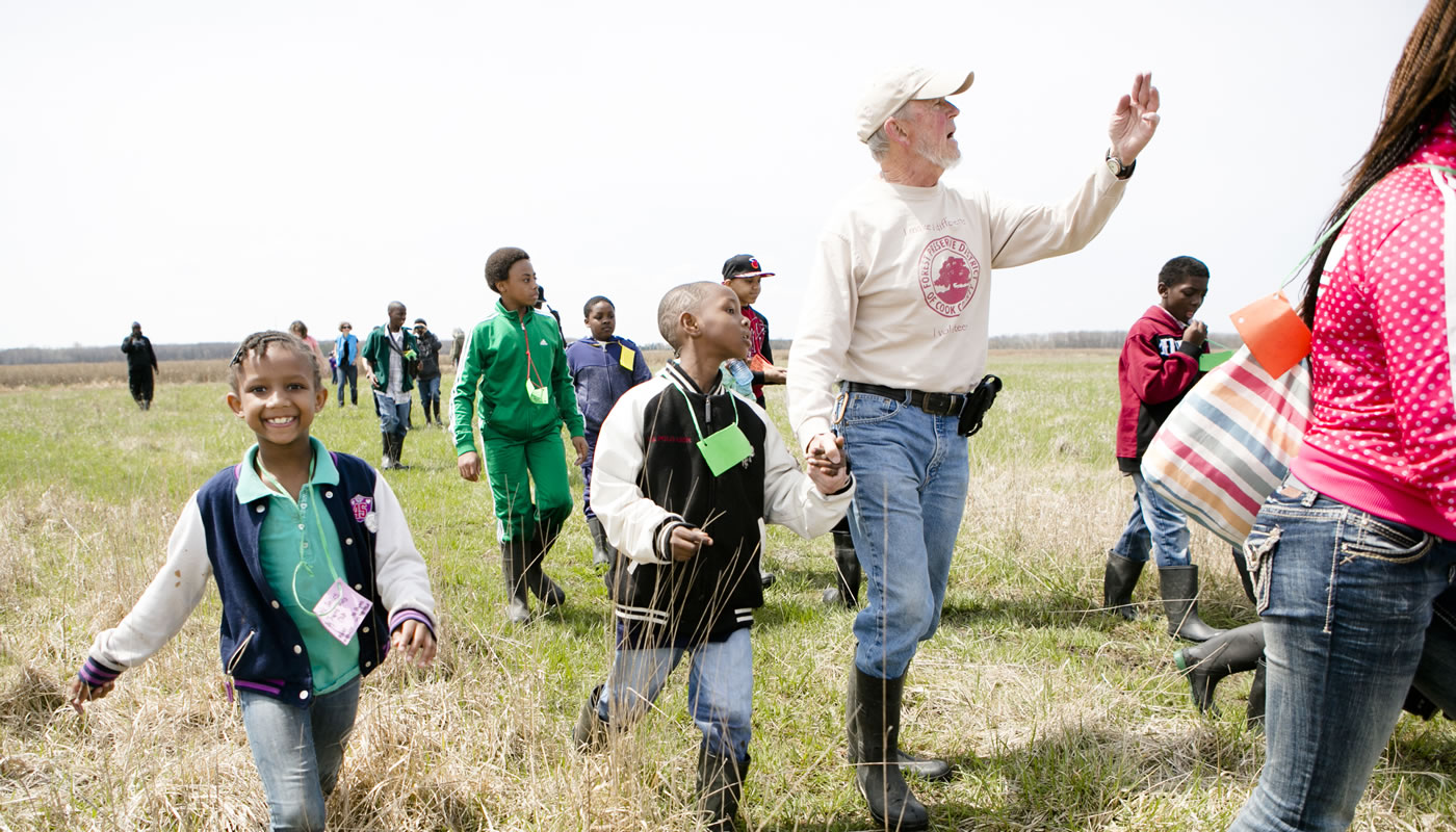 Dick Riner leading a group of students at Bartel Grassland.