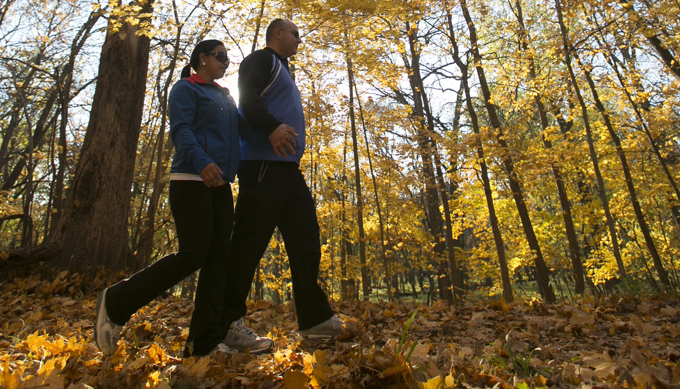 two people enjoying fall colors on the Des Plaines River Trail
