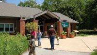people entering the Sand Ridge Nature Center building in South Holland