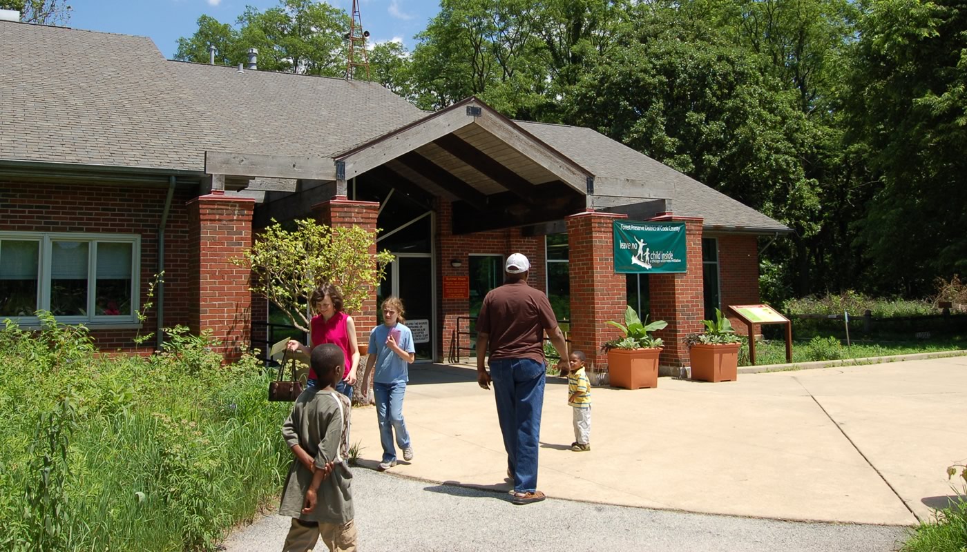 people entering the Sand Ridge Nature Center building in South Holland