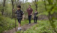 a family hiking at Trailside Museum