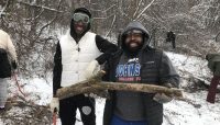 two volunteers in the snow