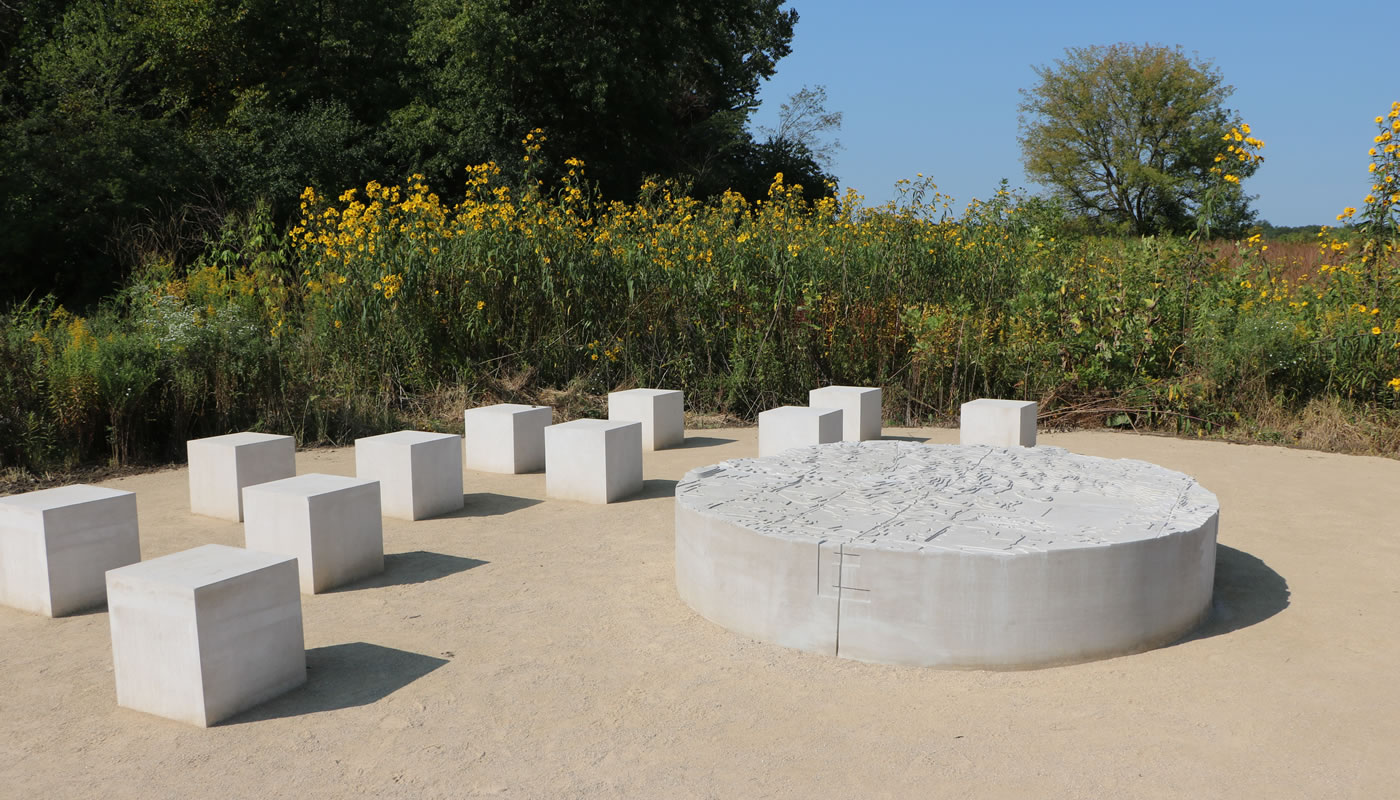 stone blocks and a topographic map in a clearing