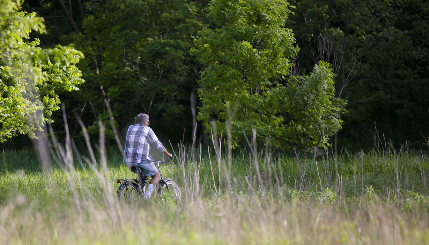 a person riding a bike at Deer Grove