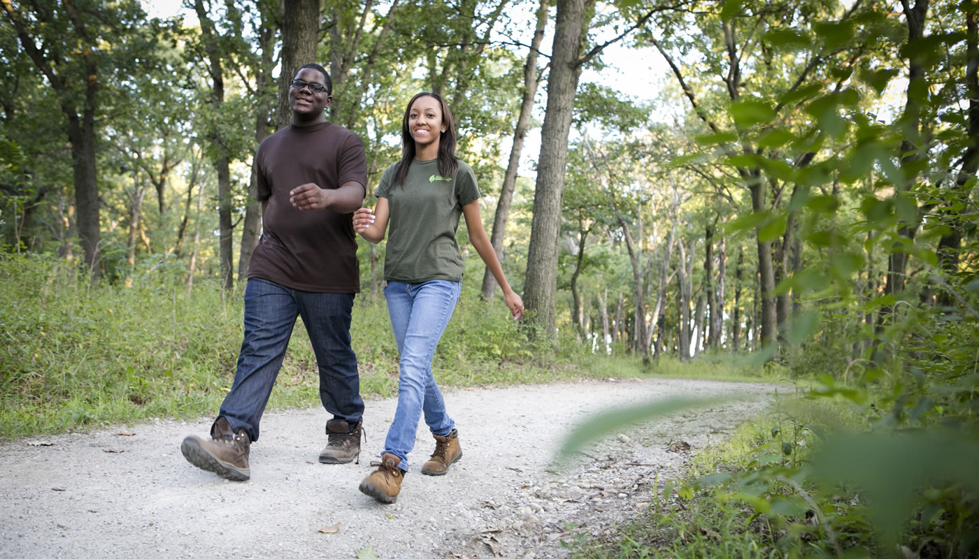 two people hiking on the Palos Trail System