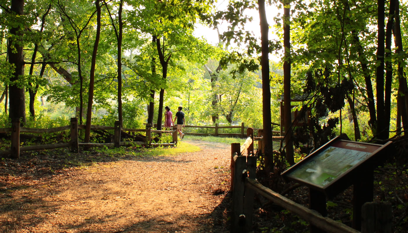 hikers at River Trail Nature Center in fall