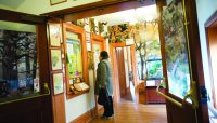 a person looks at an exhibit inside Trailside Museum