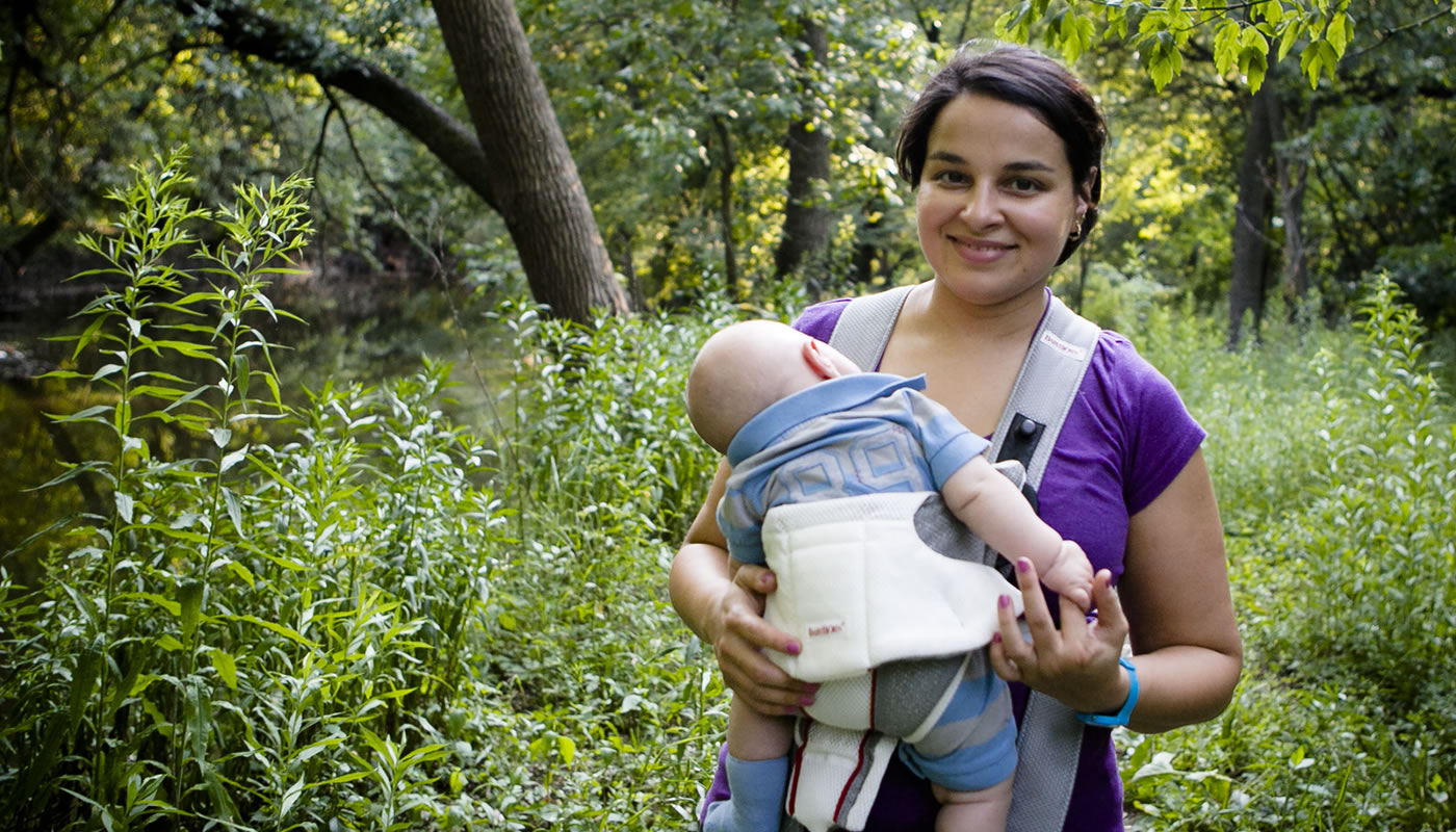a woman walking with her baby at LaBagh Woods