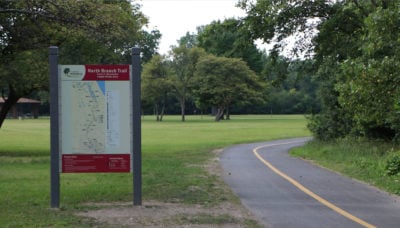 a sign with a map and rules on the North Branch Trail