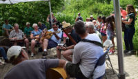people playing various instruments at a blugrass jam at Trailside Museum