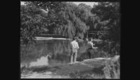 two people fishing in the Forest Preserves in the 1920s