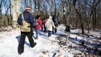 Hikers at Little Red Schoolhouse Nature Center in winter.