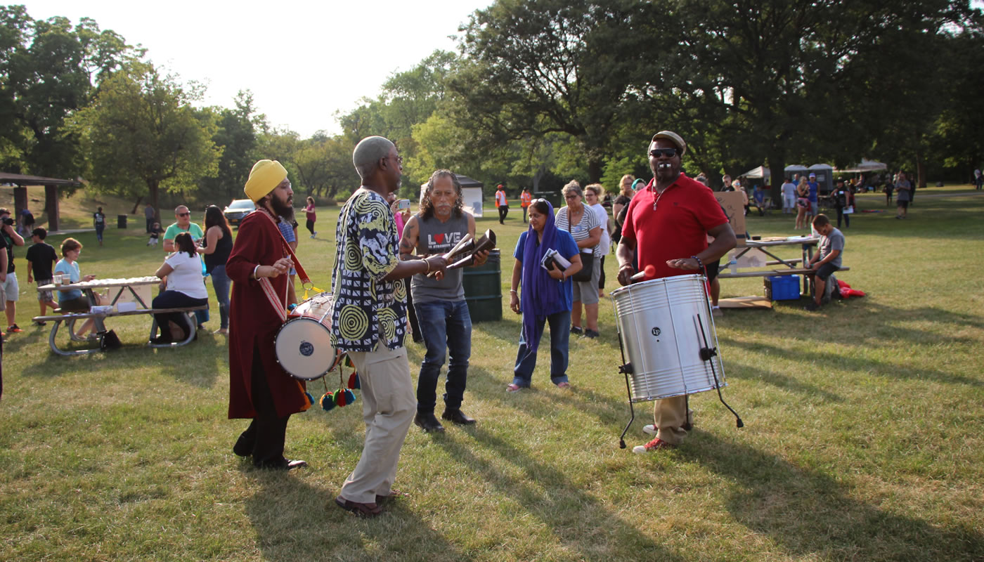 musicians walking around with drums