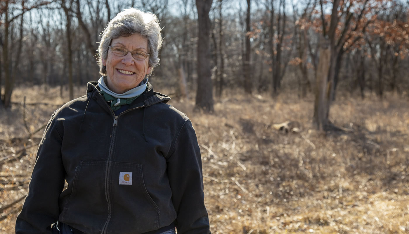 Ann Petric outside at a volunteer workday