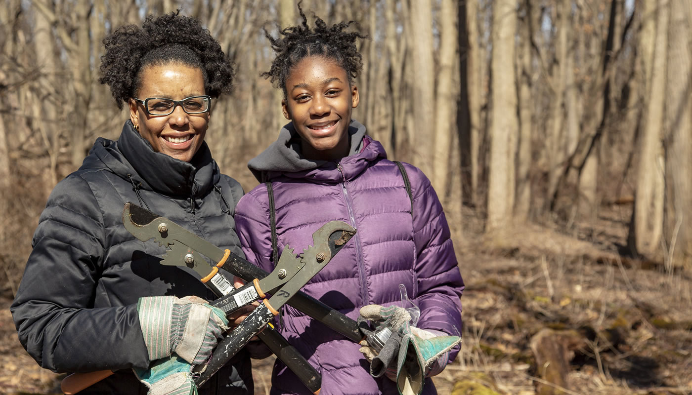 Lorrie and Kaitlyn James outside at a volunteer workday