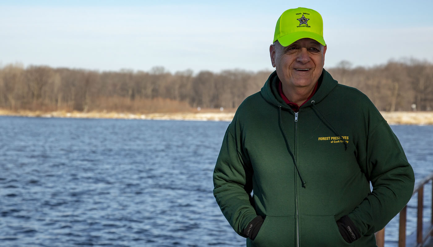 Tom Garrison in front of a lake