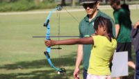 a girl participating in archery