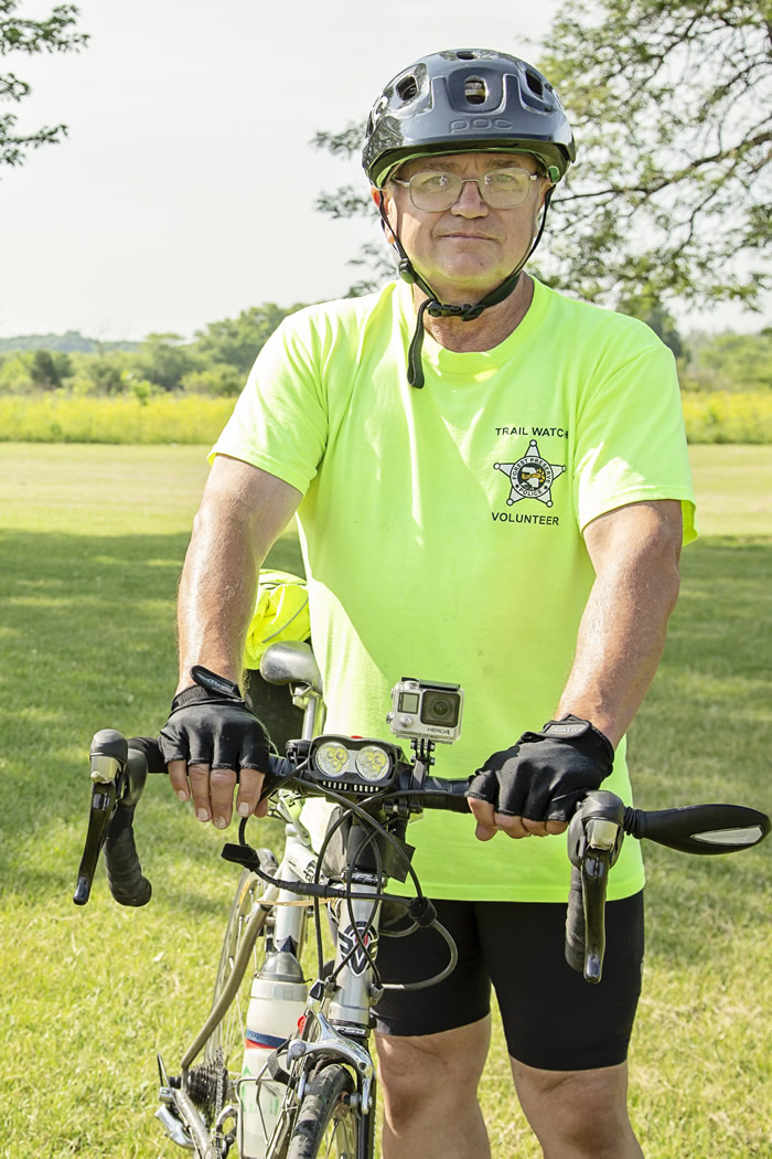 Joe Schlau with his bike on a Trail Watch Patrol