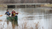 two people in a canoe on the North Branch of the Chicago River