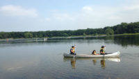 people in a canoe on Wampum Lake