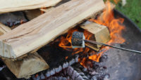 a marshmallow roasting over a campfire