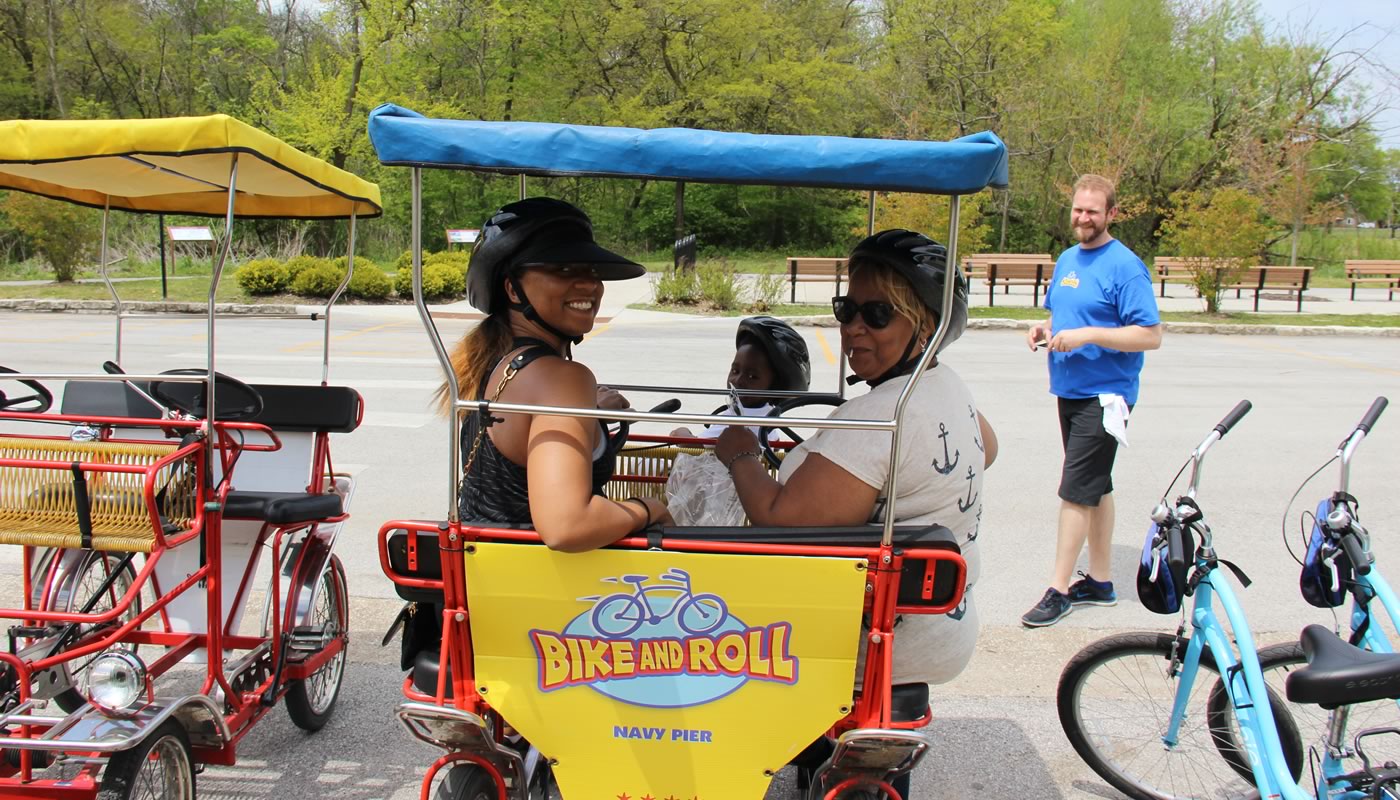a family riding a quad bike at Eggers Grove