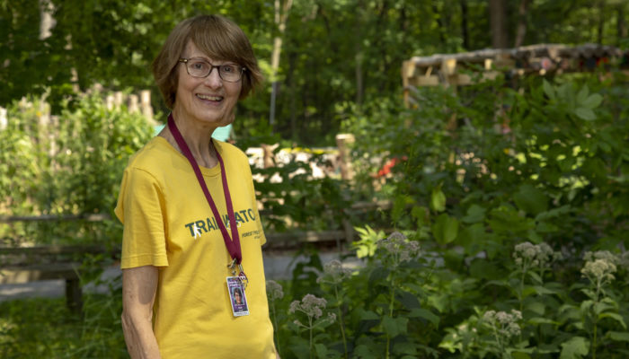 Sandi Justad standing at Little Red Schoolhouse Nature Center