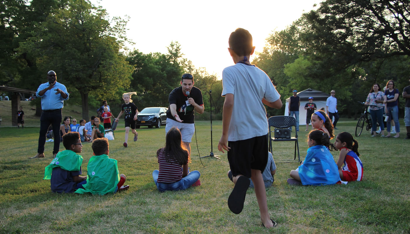 people gathering around a speaker at an event