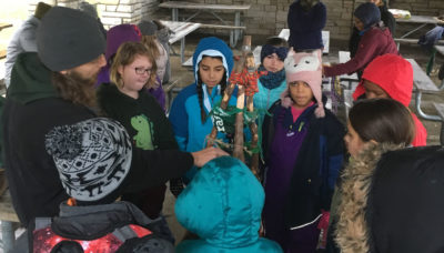 a group learning how to tie knots at LaBagh Woods