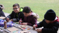 a group doing arts and crafts at Dan Ryan Woods