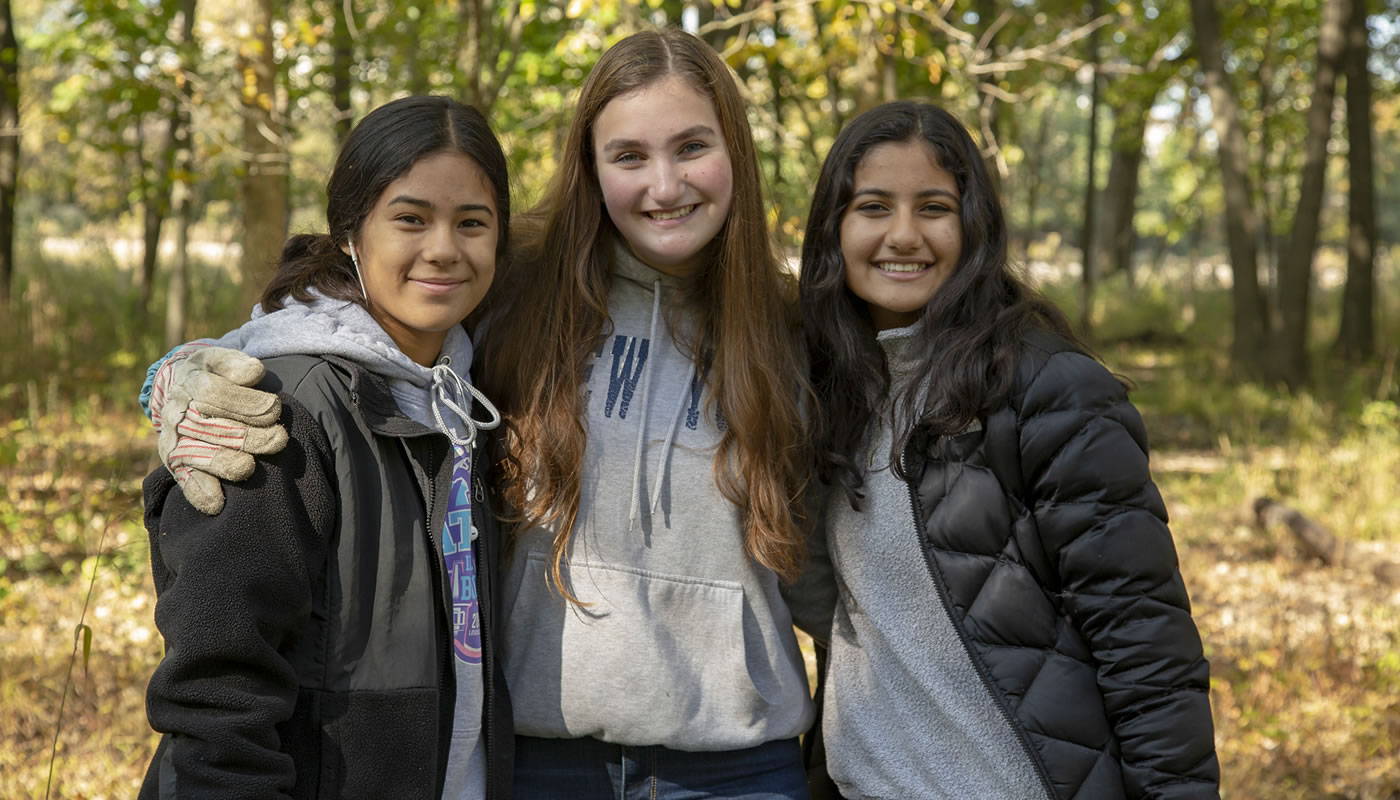 Lily, Amna and Shuli volunteering in the forest preserves