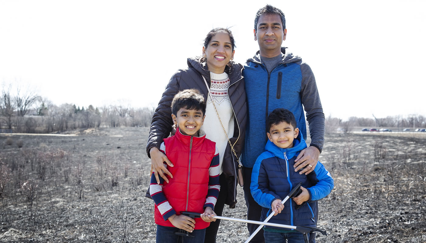 The four members of the Rimmalapudi family at their Adopt-A-Site forest preserve.