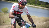 a mountain biker participating in a race on the Palos Trail System