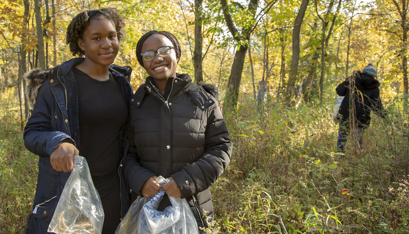 Hailey and Chantal volunteering in the Forest Preserves of Cook County
