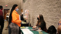 Ebony Taylor talks to Kristine Sumanis with the Forest Preserves of Cook County during the Conservation Corps Career Fair