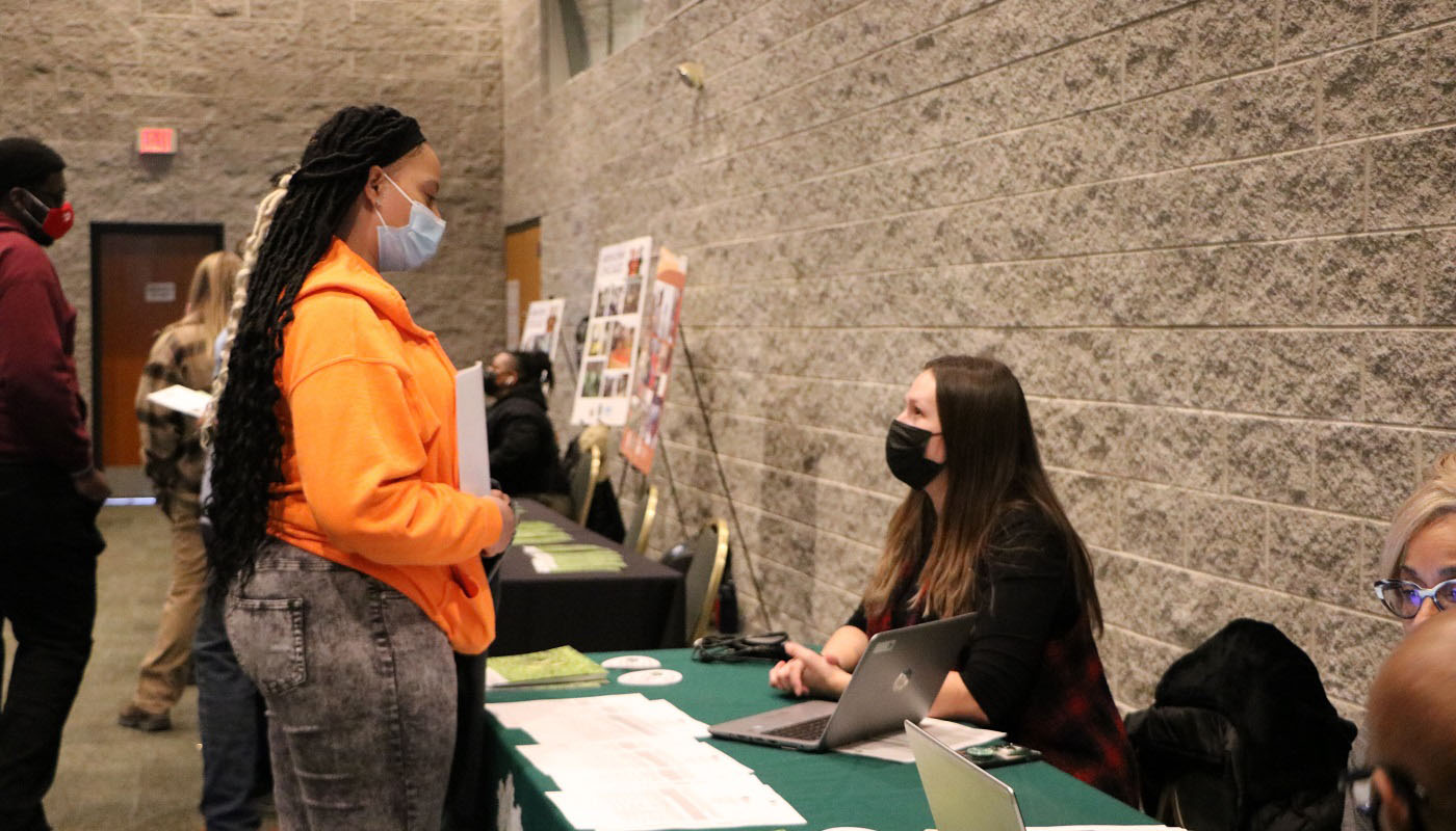 Ebony Taylor talks to Kristine Sumanis with the Forest Preserves of Cook County during the Conservation Corps Career Fair