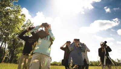 group of people birding at Penny Road Pond