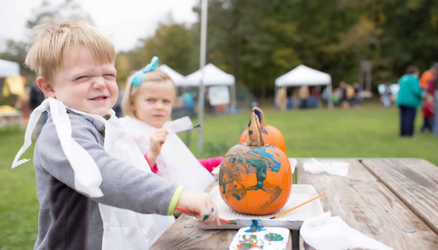 Children painting pumpkins at River Trail Nature Center.
