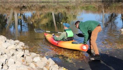 A person kayaking in the Des Plaines River