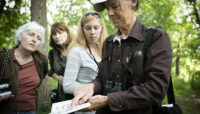 A group of people birding at Penny Road Pond.