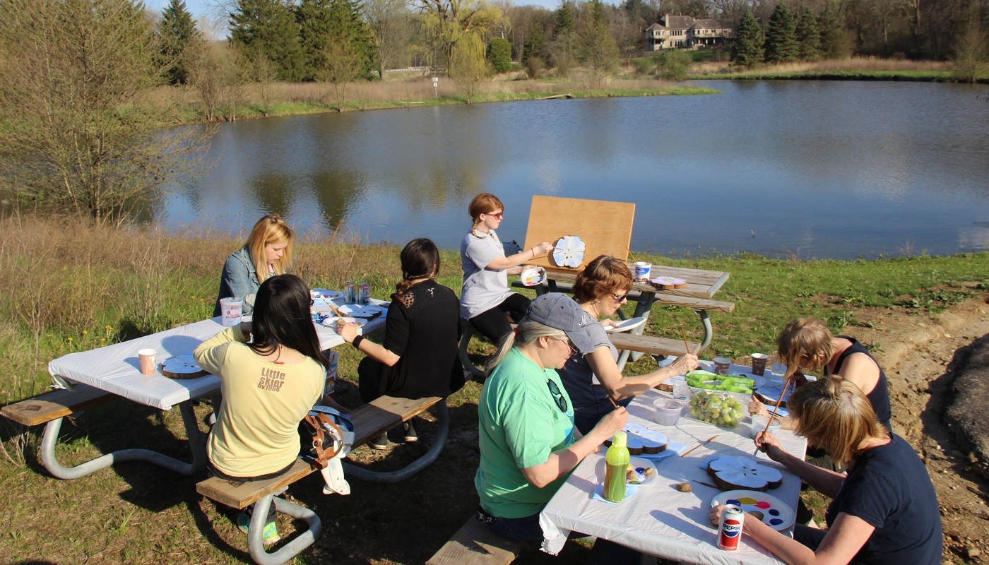 A program specialist leads a painting program at Rolling Knolls Forest Preserve