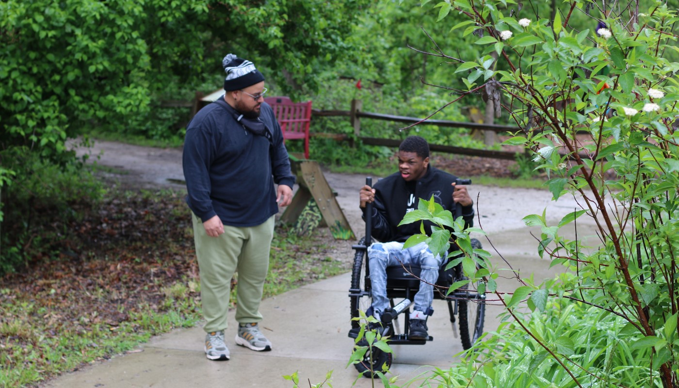 A visitor partaking in an all-terrain wheelchair demonstration at Little Red Schoolhouse Nature Center.