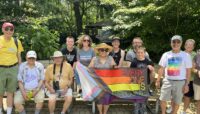 A group of people standing together outdoors.