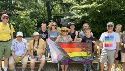 A group of people standing together outdoors.