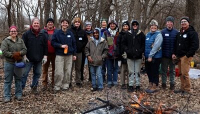 A group photo of volunteers in the field.