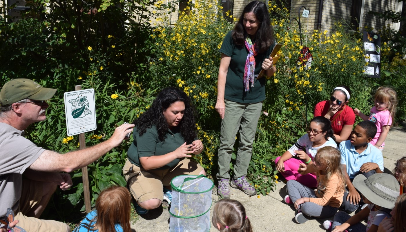 A group of people at a monarch butterfly event.
