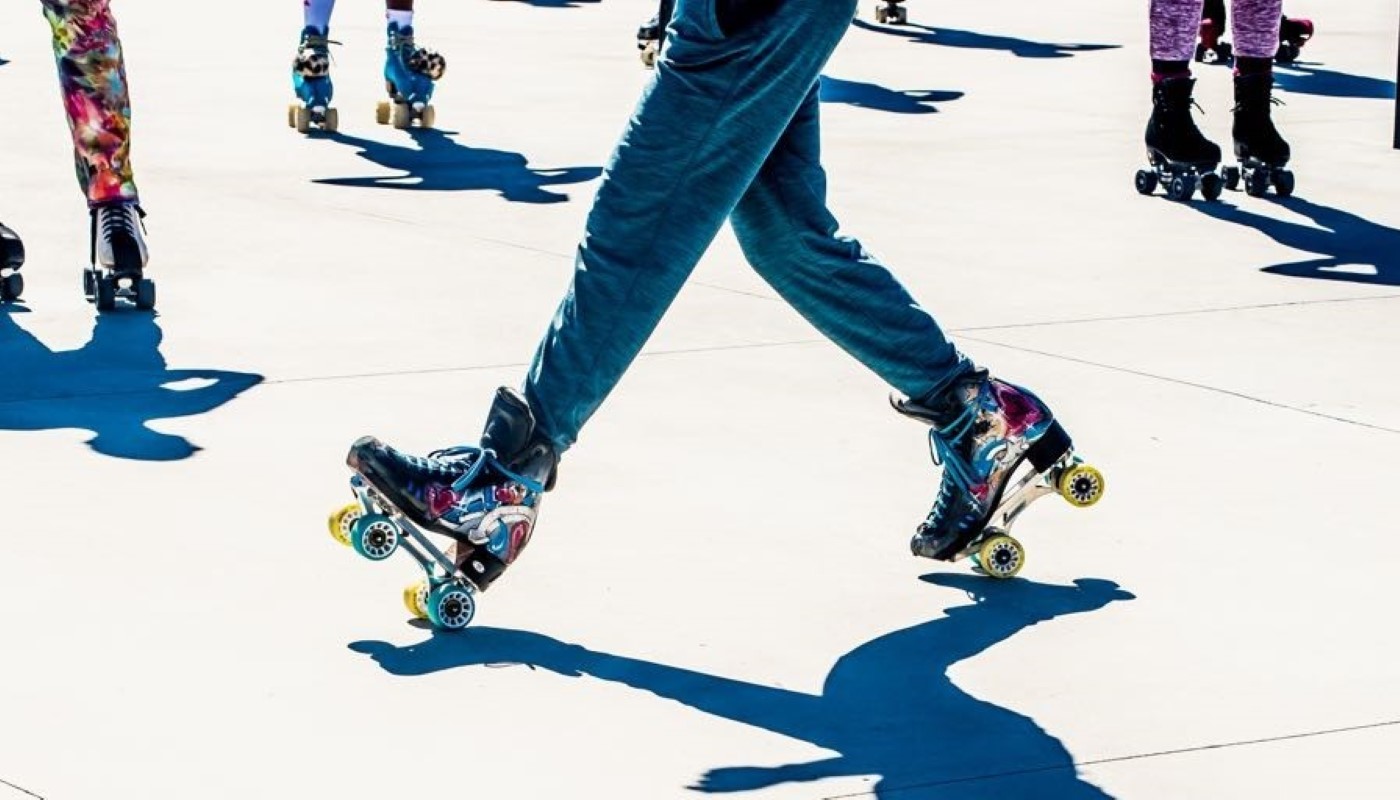 A group of people skating together.
