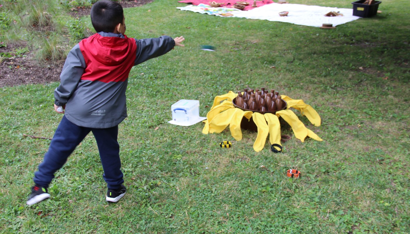 A child playing games outside.