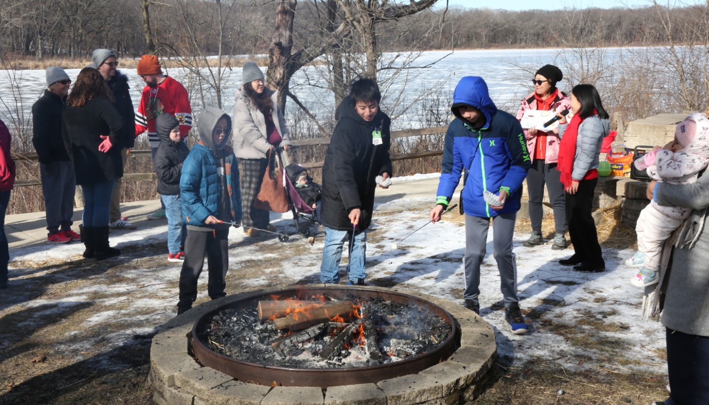 A group of people around a bonfire.