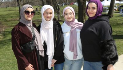 A group standing together outdoors at an event.